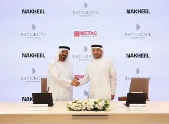 Two men shaking hands at a contract signing